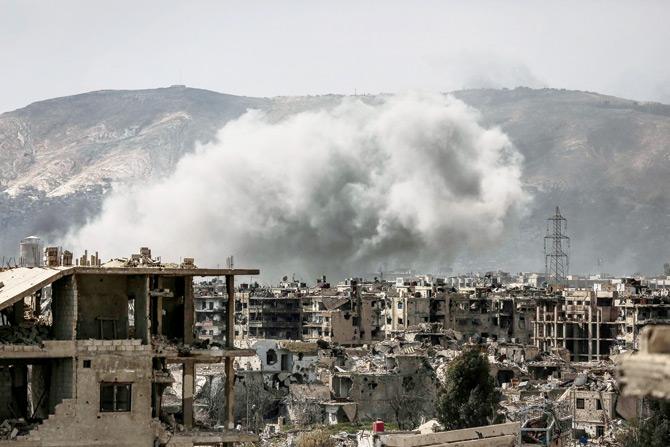 Smoke billows following a reported air strike in the rebel-held parts of the Jobar district on March 19. Pic/AFP