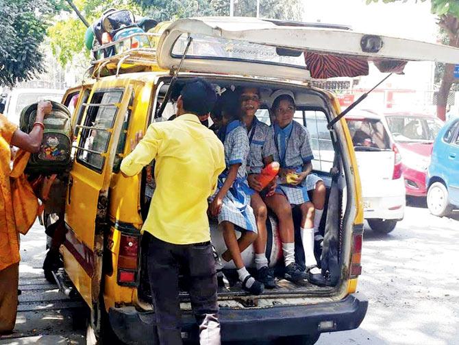 Children made to sit on top of the CNG cylinder in the van due to lack of space