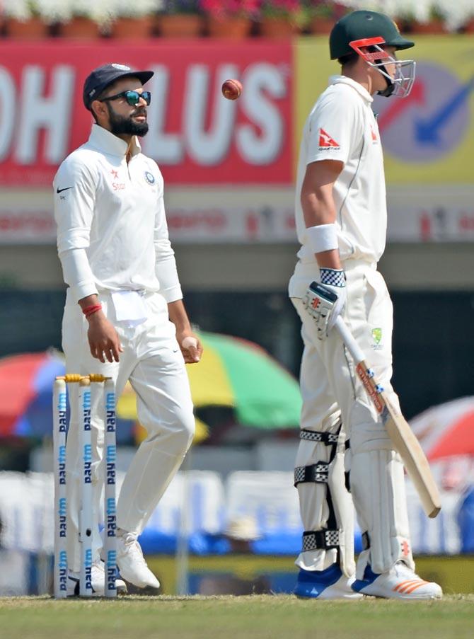 Virat Kohli and Matthew Renshaw. Pic/AFP