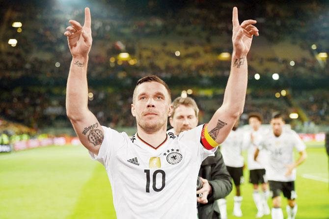 Germany’s Lukas Podolski acknowledges spectators after a friendly  against England in Dortmund, Germany on Wednesday. Pic/AFP