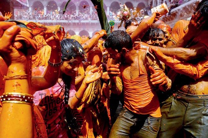 Huranga is a game played between men and women a day after Holi in which men drench women with colours and the latter tear off the clothes of the men. Pic/AFP