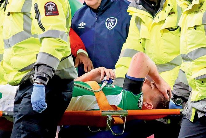Injured Ireland skipper Seamus Coleman is taken off the field during a qualifier match against Wales in Dublin on Friday. Pic/AFP