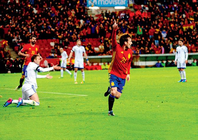 Spain’s David Silva is jubilant after scoring the opener against Israel in Gijon on Friday. Pic/AFP