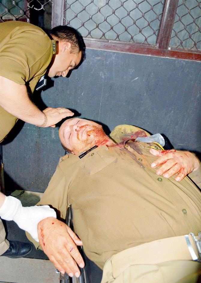 The injured personal security officer of the cleric. Pics/PTI