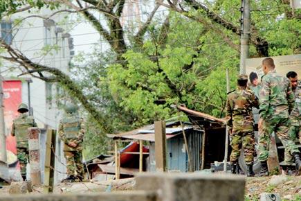 Troops try to flush out militants as blasts rock building in Bangladesh