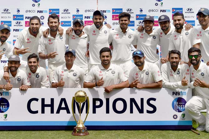 Team India with the Border-Gavaskar Trophy after beating Australia by eight wickets in the deciding fourth Test at HPCA Stadium, Dharamsala. Pic/ PTI Photo 