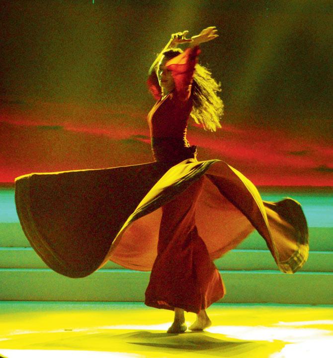 Zia Nath performs a whirling dance as part of her show Realms of Dance