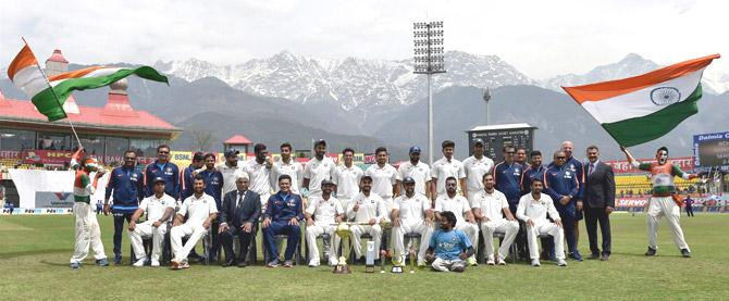 Indian cricket team with support staff and officials pose for a group photo after winning the Test series. Pic/PTI