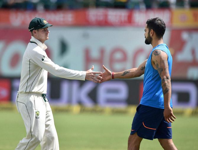  Indian skipper Virat Kohli being greetd by Australian captain Steve Smith. Pic/PTI