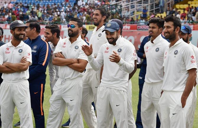 Virat Kohli with team mates at award ceremony after winning the test series against Australia. Pic/PTI