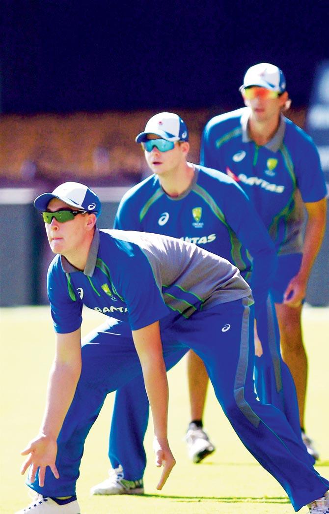 Australia’s Matt Renshaw, Steve Smith and Ashton Agar during a training session in Bangalore yesterday. Pic/PTI