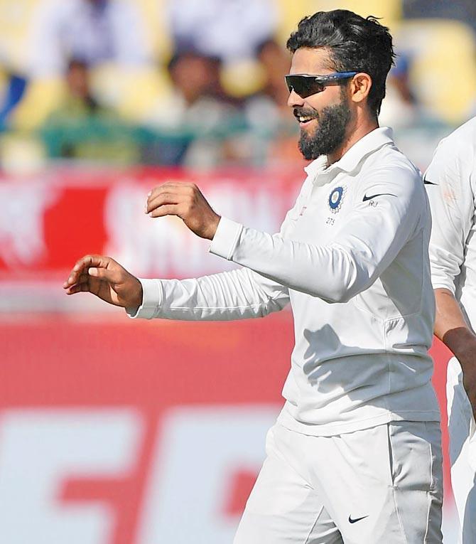 India’s Ravindra Jadeja celebrates the wicket of Australia’s Steve O’Keefe during Day Three of the Dharamsala Test on Monday. Pic/AFP