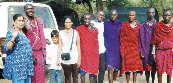 Rita Theobald (fourth from left) with her family and the tribes of Maasai Mara