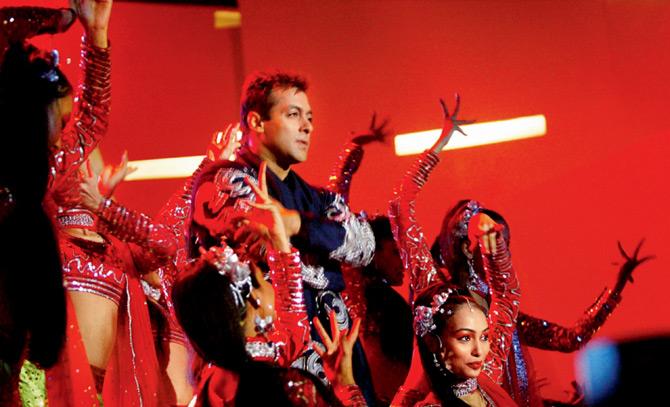 Salman Khan performs with back-up dancers. Pic/Getty Images