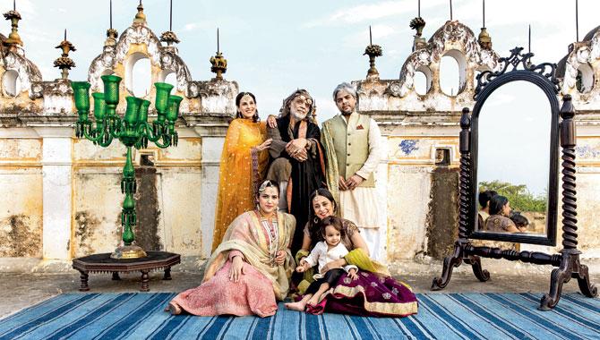 Muzaffar Ali (centre) and Meera Ali (standing left) with daughter Sama (seated left), son Shaad, daughter-in-law Aarti Patkar (seated right) and grandson Imaan feature in the just-launched title, Dining with the Nawabs by Meera Ali and Karam Puri