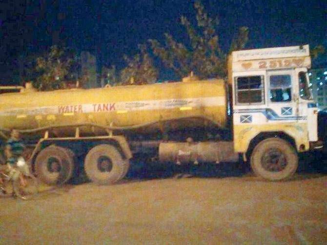 The water tanker that ran over the dogs after the driver reversed the vehicle carelessly