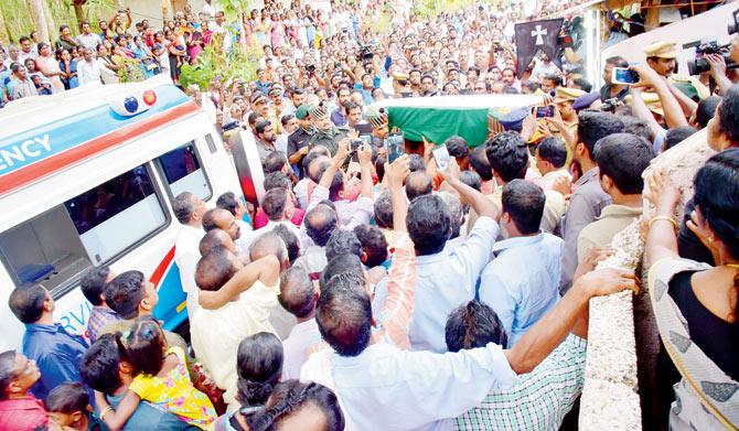 Lance Naik Roy Mathew’s funeral was held in Kerala on Saturday with ministers making a beeline to reach his grieving widow Fini, Pic courtesy: Kollam (rural) police