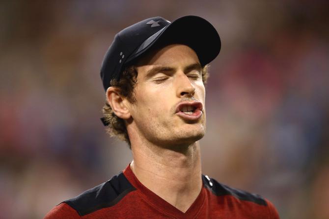 Andy Murray of Great Britain shows his frustration during his straight sets defeat by Vasek Pospisil