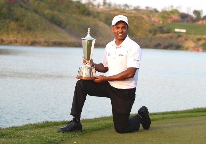 Indian golfer SSP Chawrasia poses with the trophy after he won the Hero Indian Open golf tournament