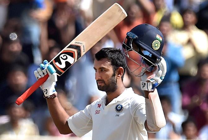 Indian batsman C.Pujara acknowledging crowds after complete his century. Pic/PTI