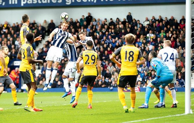 West Brom’s Craig Dawson heads to score his second goal during the EPL match against Arsenal at The Hawthorns in West Bromwich on Saturday. Pics/GETTY IMAGES
