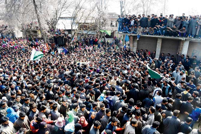 Villagers during the funeral procession of rebel Tauseef Ahmed Wagay at Kanjkul village in Kulgam district. Pic/AFP
