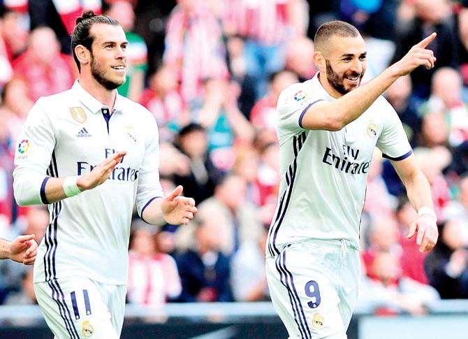 Karim Benzema (right) and Gareth Bale celebrate after the former scores Real Madrid’s opening goal. Pic/AFP