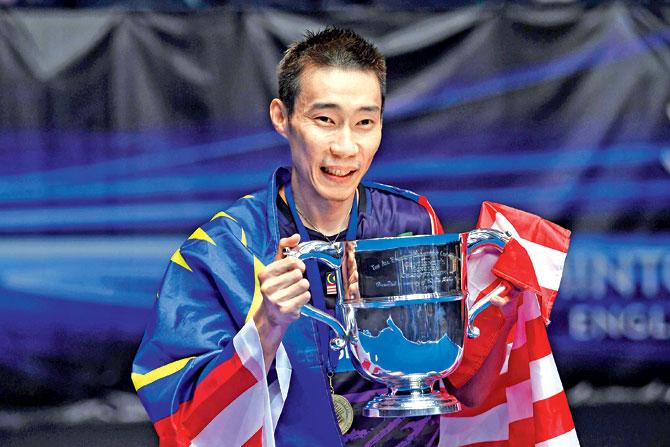 Malaysia’s Lee Chong Wei poses with the All England winner’s trophy on Sunday. pic/afp