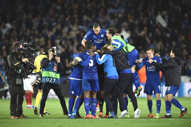 Leicester players celebrate their victory at the end of the UEFA Champions League round of 16 second leg football match between Leicester City and Sevilla