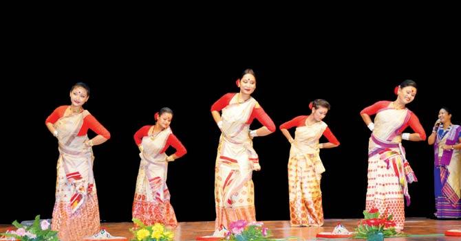 A group of Assamese dancers perform Jhumur, the dance form associated with tea gardens