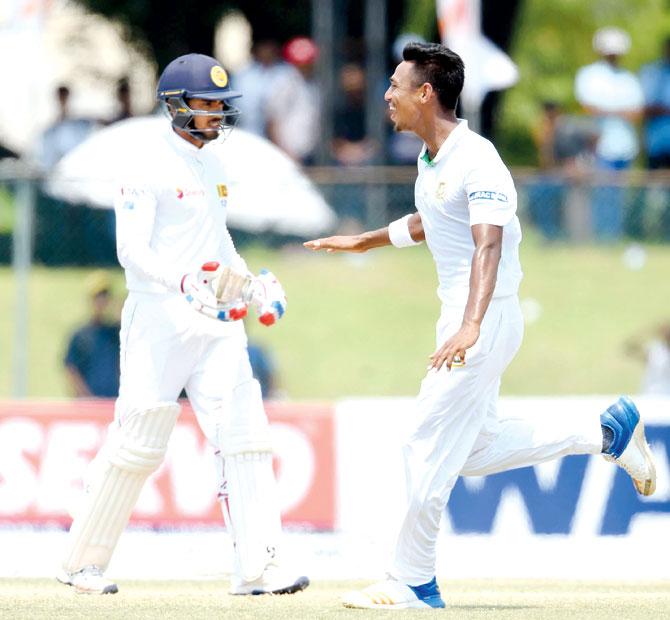 Bangladesh pacer Mustafizur Rahman celebrates the wicket of SL’s Dhananjaya de Silva (left) in Colombo on Saturday. PIC/AFP