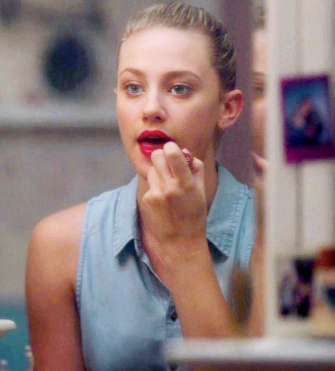 In Riverdale, we see Betty in front of her mirror, applying ‘Seduce Scarlet’ onto her lips and, in doing so, embodying the energy of a badass. Pic/Netflix