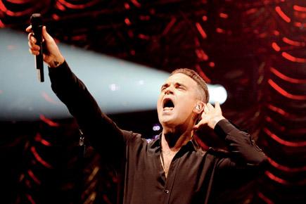 Robbie Williams to release next collection of songs on YouTube