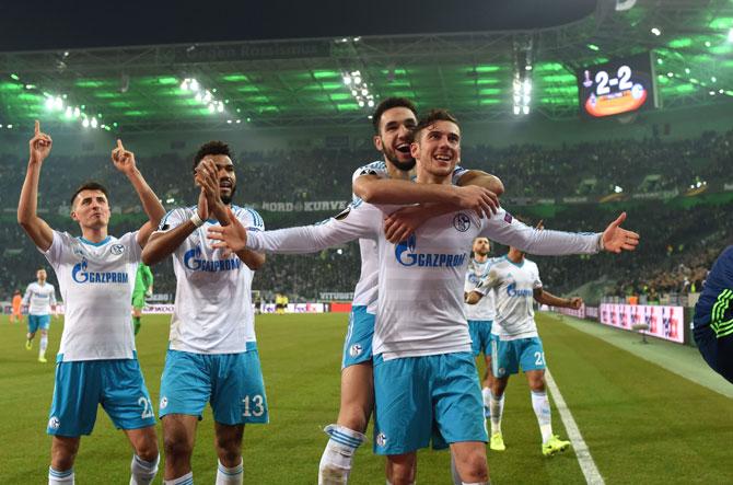 Schalke´s players celebrate after the UEFA Europa League Round of 16, 2nd leg football match Borussia Moenchengladbach v FC Schalke 04