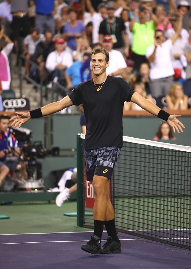 Vasek Pospisil of Canada celebrates match point against Andy Murray