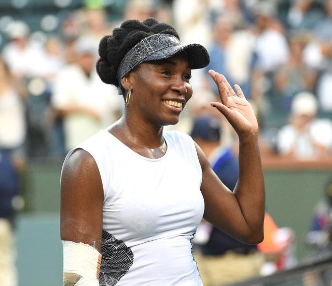 Venus Williams of the United States celebrates after defeating Jelena Jankovic
