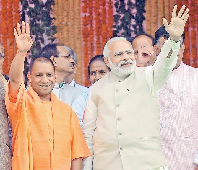 Chief Minister of Uttar Pradesh Yogi Adityanath and Prime Minister Narendra Modi (R) at the former’s swearing-in ceremony in Lucknow. Pic/PTI