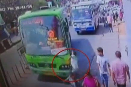 Watch Video: Man busy on mobile gets hit by speeding bus 