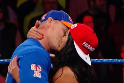 Kiss-a-thon! John Cena and Nikki Bella smooch on WWE SmackDown