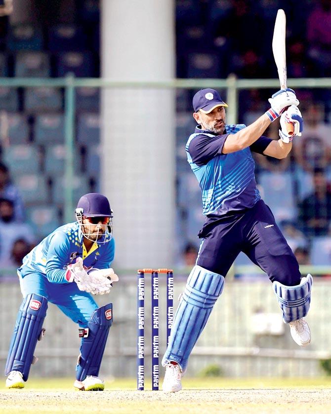 Jharkhand skipper MS Dhoni during the Vijay Hazare Trophy semi-final against Bengal in New Delhi on Saturday. Pic/PTI