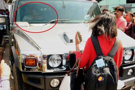 Photos: Crazy fan moment! Stalker blocks Mahi's way at Ranchi airport