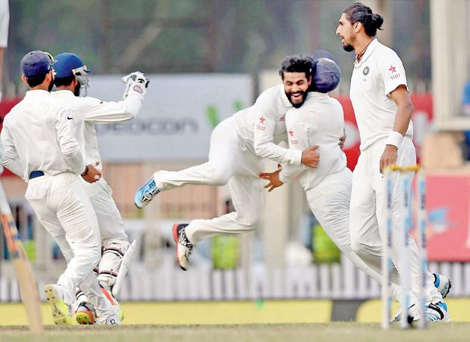 Ravindra Jadeja (centre) is ecstatic after the dismissal of David Warner on Day Four of the third India-Australia Test in Ranchi yesterday. Pic/PTI