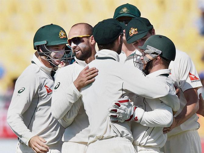 Australia wicketkeeper Matthew Wade(C), Nathan Lyon celebrate wicket of Karun Nair during the second day of last Test match against India at HPCA Stadium in Dharamshala on Sunday. 