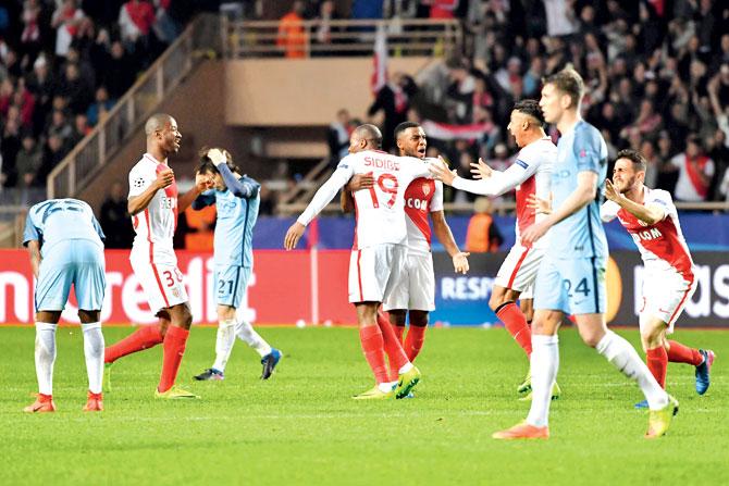 Monaco players celebrate their 3-1 win over Man City at the end of the Champions League Round-of-16 tie in Monaco on Wednesday. Pic/AFP
