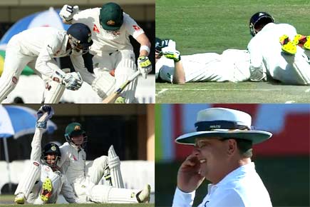 Video: Wriddhiman Saha 'wrestles' with Steven Smith to take 'catch'