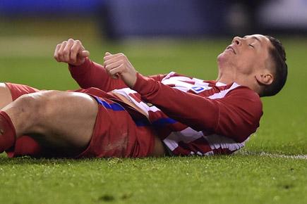 Atletico's Fernando Torres eager to return after head injury scare