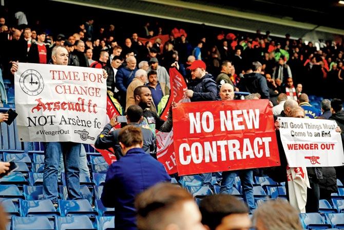 Disappointed Arsenal fans display anti-Arsene Wenger banners in West Bromwich on Saturday