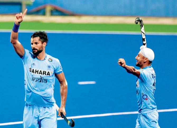 India’s Rupinder Pal Singh (left) celebrates with Talwinder Singh after scoring the first goal against New Zealand during the play-off of the Sultan Azlan Shah Cup in Ipoh on Saturday. Pic/AP, PTI