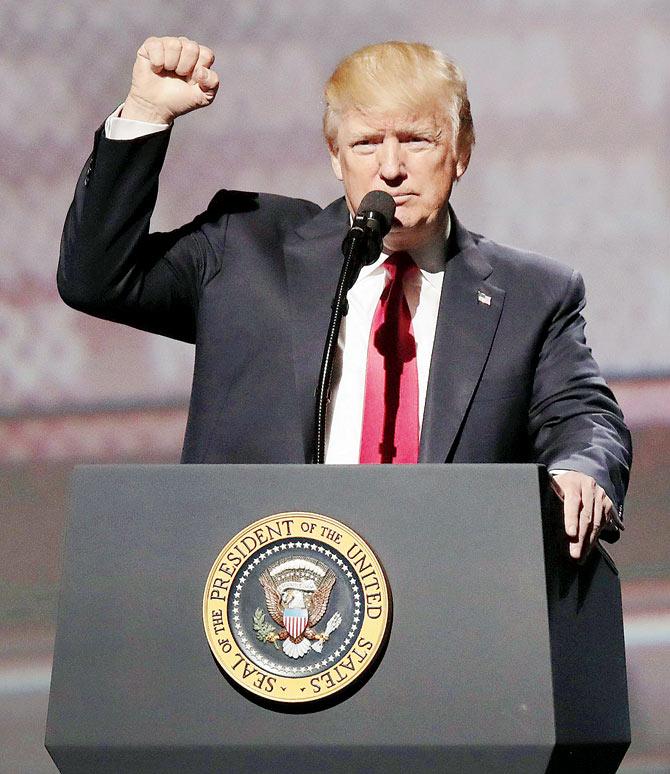 A day before completing 100 days in office,  Donald Trump addressed the National Rifle Association, an organisation that had given him full-throated support. Pic/AFP