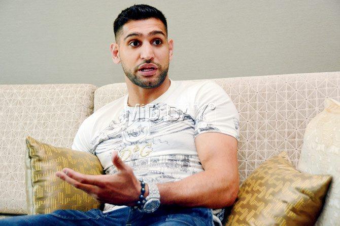 British boxer Amir Khan speaks out during his Mumbai visit yesterday to promote the Super Boxing League. Pic/Sneha Kharabe